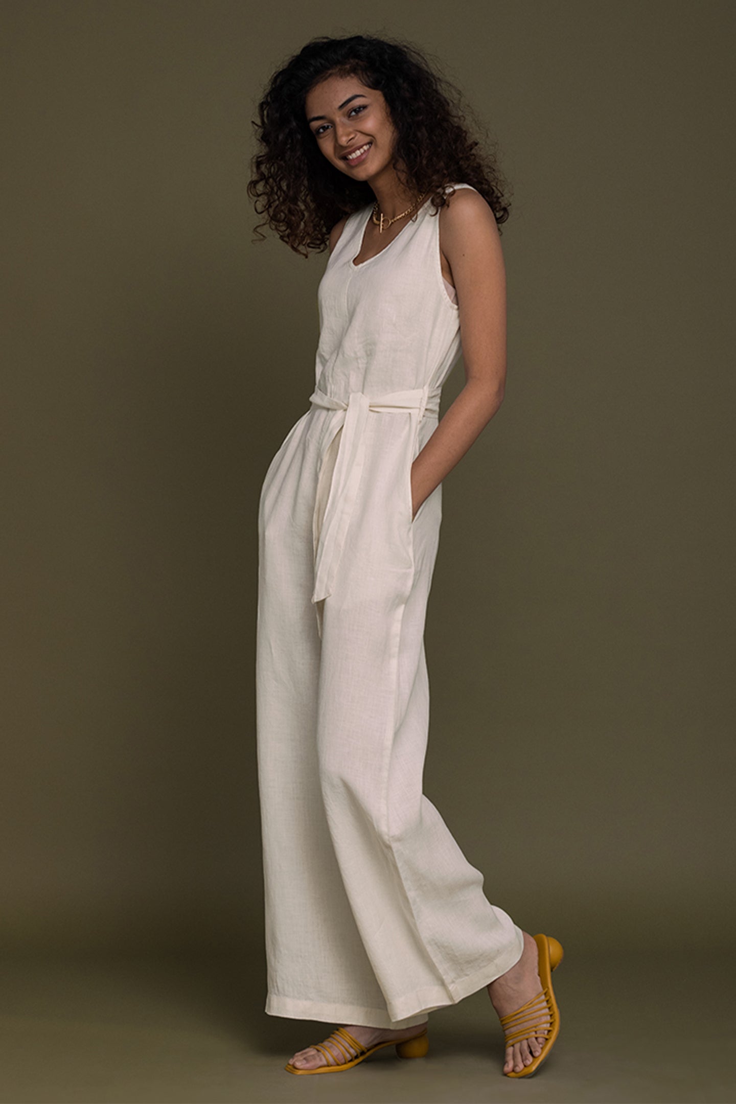 With a modern V-neck, this flattering wide-leg jumpsuit with a tie-up sash is a chic and comfortable on-trend wardrobe must-have. women_fashion - littlescollection