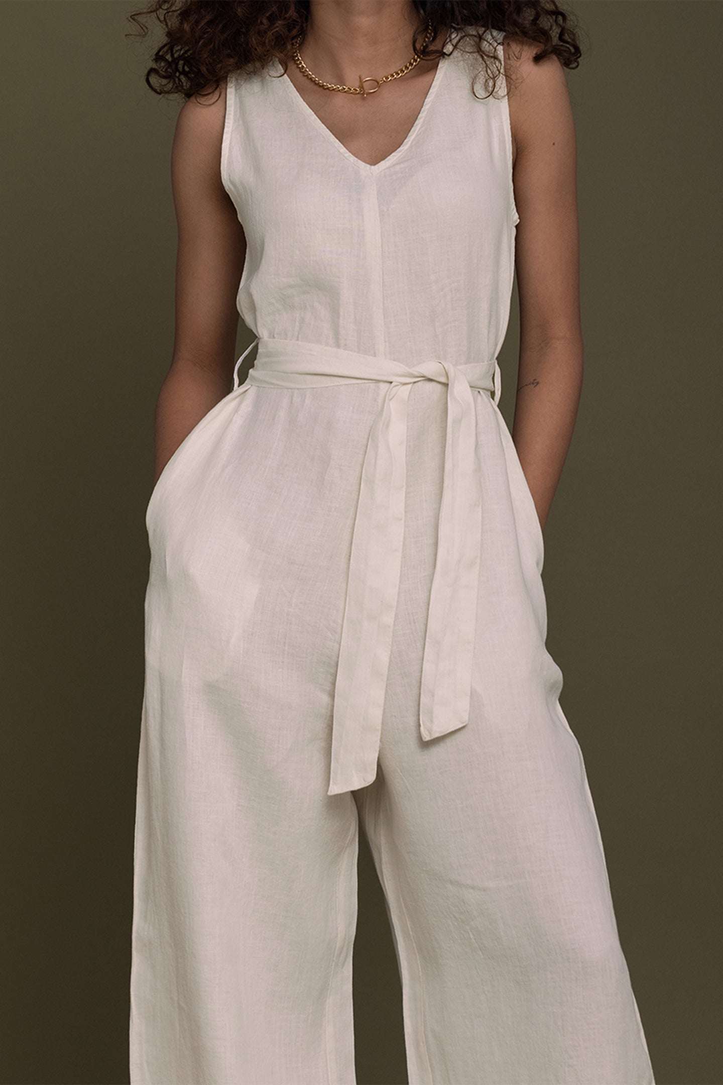 high-end modern V-neck, this flattering wide-leg jumpsuit with a tie-up sash is a chic and comfortable on-trend wardrobe must-have. women_fashion - littlescollection