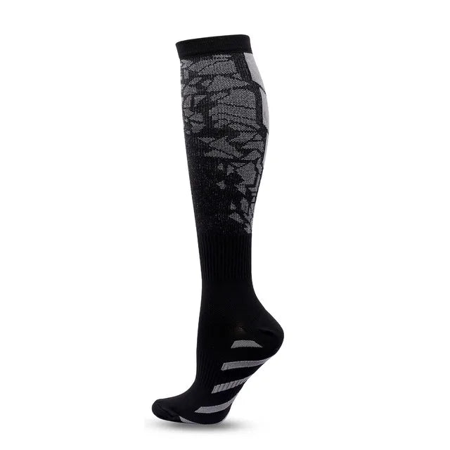 The Littles Collection Compression Socks Varicose Veins Medical Marathon is a single black knee-high athletic sock with gray geometric patterns and white foot stripes, shown on a mannequin leg against a white background.