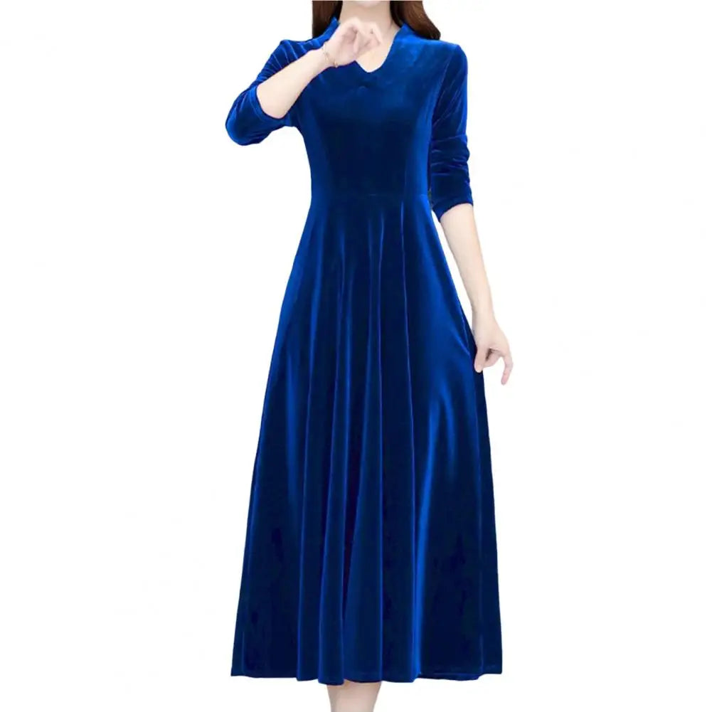 Blue dress worn by a model on a white background