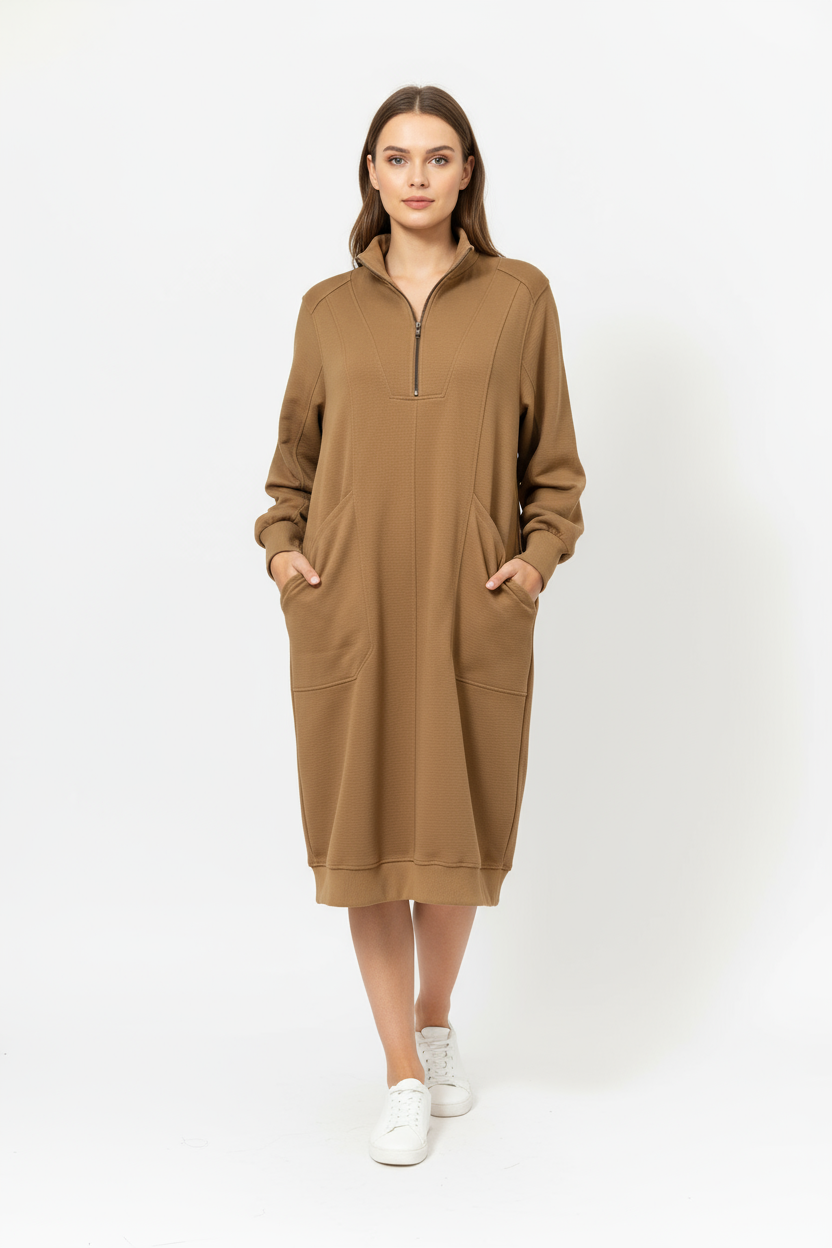 A woman wearing a brown sweater dress with pockets.