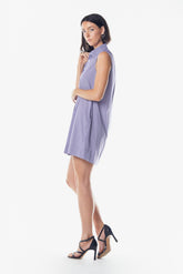 Woman wearing a light purple dress on a white background