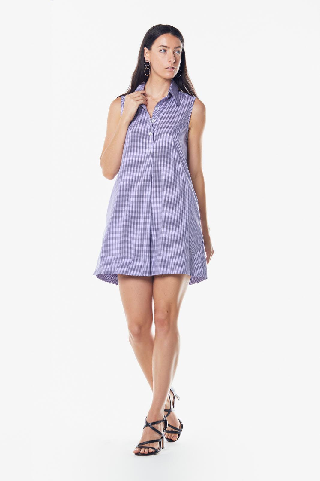 Woman wearing a light purple sleeveless dress on a white background