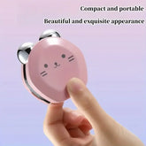 Compact pink mirror with cat face design held by a hand against a light purple background