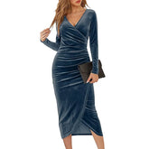 Blue velvet dress worn by a model on a white background