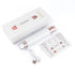 White and rose gold beauty device with packaging, USB cable, and user manual on a white background