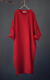 Red dress hanging on a gray background