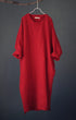 Red dress hanging on a gray background